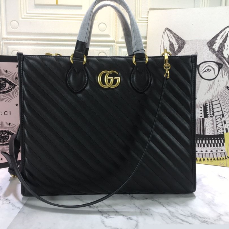 G*u*i shopping bags